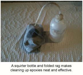 Using a squirter bottle like this and a folded rag is an effective way to clean up epoxies.