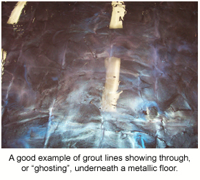 Grout lines showing through under a metallic floor applied over floor tiles.