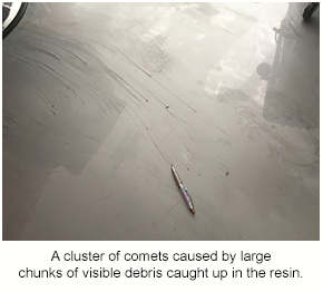 A cluster of comets on a metallic epoxy floor.