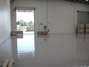 A thin-film rollcoat system on a warehouse floor.