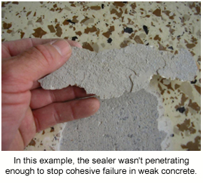 The underside of the coating showing how the sealer didn't prevent the weak concrete from failing.